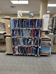 Quilts on a shelf in the Quilts of Valor store.