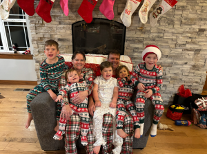 Julie and her husband, Jeff, with their five grandchildren two weeks after Julie's surgery.